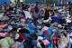 People choose clothes donated to those affected by the earthquakes at a sports complex in La Guaira, Venezuela, Saturday, July 4, 2026.