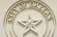 The seal over the Dallas City Council chambers on Jan. 14 at Dallas City Hall. Contributing columnist Dallas Cothrum writes that the July council recess should become a thing of the past.