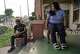 From left, Jorge Luis Gonzales, 60, and Savanna Gómez, 24, sit on the porch of their home near the scene of an officer-involved shooting during a federal immigration enforcement operation in Houston on Tuesday, July 7, 2026. The shooting is under investigation by the Federal Bureau of Investigation.