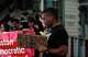 Jose V., 36, holds a sign as people gather to protest following an officer-involved shooting during a federal immigration enforcement operation in Houston on Tuesday, July 7, 2026. The shooting is under investigation by the Federal Bureau of Investigation.