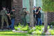 Immigration and Customs Enforcement officers arrest a man who the agency said they were pursuing barricaded himself inside the house in Spring, Wednesday, July 8, 2026.