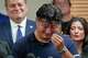 Ronaldo Salgado, son of Lorenzo Salgado Araujo, wipes away tears while speaking during a news conference Wednesday, July 8, 2026, in Houston.