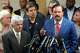 Johnny Mata, left, and Roman Palomares, LULAC national president, second from left, are shown as Domingo Garcia, speaks during a news conference about the ICE shooting death of Lorenzo Salgado Araujo in Houston Wednesday, July 8, 2026.