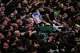 The coffin of the late Iranian Supreme Leader Ayatollah Ali Khamenei is carried through a tightly packed crowd as mourners jostle to reach and touch it outside the Imam Hussein Shrine in Karbala, Iraq, early Thursday, July 9, 2026.