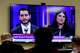 Michigan U.S. Senate candidates, Abdul El-Sayed, left, and Rep. Haley Stevens, D-Mich., are displayed on a television during a debate inside the spin room at WoodTV studios on Tuesday, July 7, 2026, in Grand Rapids, Mich.