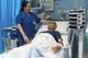Cuban doctor Daysi Luperon Loforte talks with Teodoro Crea, a patient hospitalized in the emergency unit of the Santa Maria degli Ungheresi Hospital of Polistena, in the southern Italian Calabria region, June 16, 2026.