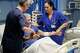 Cuban doctor Daysi Luperon Loforte, right, helps lift up Francesco Ascone, a patient hospitalized in the emergency unit of the Santa Maria degli Ungheresi Hospital of Polistena, in the southern Italian Calabria region, June 16, 2026.