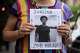 A person holds a picture of Nolan Xavier Wells during a news conference at National Action Network headquarters, Friday, July 10, 2026, in New York.