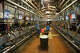FILE: Workers perform milking operations in the interior of a dairy parlor at a large California dairy in the San Joaquin Valley.