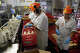 FILE: Workers at the processing plant of the Straus Family Creamery in Marshall, Calif., on March 24, 2016.