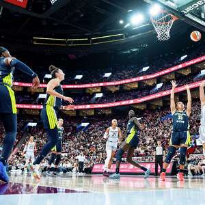 WNBA regular-season record crowd of 20,996 watches Wings beat Tempo in Montreal