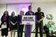 U.S. Rep. Christian Menefee speaks during a community vigil for Lorenzo Salgado Araujo as U.S. Rep. Sylvia Garcia, left, and U.S. Rep. Al Green look on in Houston on Saturday, July 11, 2026. (Raquel Natalicchio/Houston Chronicle via AP)