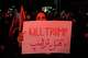 A pro-government demonstrator holds an anti-Trump placard in a gathering commemorating the late Iranian Supreme Leader Ayatollah Ali Khamenei at a square in Tehran, Saturday, July 11, 2026.