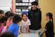 Chief Leschi Schools senior Gerald Dillon, 18, who serves as a teaching assistant through the school's career and technical education program, listens to a second grade student describe the parts of their Play-Doh insect in class Wednesday, March 18, 2026, at Chief Leschi Schools in Puyallup, Wash.