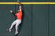 Houston Astros center fielder Brice Matthews can’t make a leaping play on a triple by Texas Rangers third baseman Josh Jung during the first inning of a baseball game at Globe Life Field on Sunday, July 12, 2026, in Arlington.
