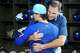 Texas Rangers president of baseball operations Chris Young (facing) hugs pitcher Jacob Latz before Latz was recognized as a member of this year’s American League All Star Team prior to a baseball game against the Houston Astros at Globe Life Field on Sunday, July 12, 2026, in Arlington.