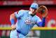 Texas Rangers first baseman Jake Burger makes a play on a grounder by Taylor Trammell of the Houston Astros during the second inning of a baseball game at Globe Life Field on Sunday, July 12, 2026, in Arlington.