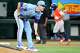 Texas Rangers pitcher MacKenzie Gore tosses a rosin bag as Jose Altuve of the Houston Astros round the bases after hitting a home run during the fourth inning of a baseball game at Globe Life Field on Sunday, July 12, 2026, in Arlington.