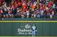 Texas Rangers left fielder Wyatt Langford looks away as a halftime by Houston Astros outfielder Cam Smith lands in the seats during the eigth inning of a baseball game at Globe Life Field on Sunday, July 12, 2026, in Arlington.