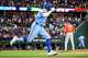 Texas Rangers right fielder Brandon Nimmo pumps his fist as he heads down the line after hitting a walk-off single during the ninth inning of a baseball game against the Houston Astros at Globe Life Field on Sunday, July 12, 2026, in Arlington.