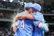 Texas Rangers right fielder Brandon Nimmo (24) hugs teammate Wyatt Langford after he was doused with ice water after Nimmo hit a game-winning walk-off single in the ninth inning of a 6-5 victory over the Houston Astros in baseball game at Globe Life Field on Sunday, July 12, 2026, in Arlington.