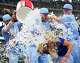 Field reporter Michelle Montaine tries to duck out of the way as Texas Rangers right fielder Brandon Nimmo is doused with ice water by teammates Ezequiel Duran (let) and Wyatt Langford after Nimmo hit a game-winning walk-off single in the ninth inning of a 6-5 victory over the Houston Astros in baseball game at Globe Life Field on Sunday, July 12, 2026, in Arlington.
