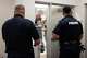Police and Fire Marshalls prevent additional people from entering city council chambers after it reached its 130 person capacity before a council meeting in Red Oak, Monday, May 11, 2026. About 50 stood in a hallway outside of the chambers for the duration of the nearly 5-hour meeting.