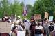Protesters gather near the scene of a shooting involving U.S. Immigration and Customs Enforcement, Monday, July 13, 2026 in Biddeford, Maine.