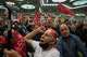 Mourners chant as they raise their fists during a gathering commemorating the late Supreme Leader Ali Khamenei at the Imam Khomeini Mosalla Grand Mosque in Tehran, Iran, Tuesday, July 14, 2026.