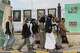 Houthi supporters walk in front of posters of some top Iranian scientists who have been killed in Israeli strikes, in Sanaa, Yemen, Monday, July 13, 2026.
