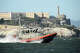 A U.S. Coast Guard crew goes past Alcatraz Island near the site of a boat accident on Tuesday, July 14, 2026, in San Francisco.