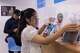 Kanticha Singkhon, 25, picks up the personal belongings of her mother, who died in Sunday's bar fire, at Phahonyothin Police Station in Bangkok, Thailand on Wednesday, July 15, 2026.