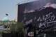 A billboard depicting U.S. President Donald Trump lying on what appears to be a coffin and bearing anti-Trump messages, including the phrase "We Kill Trump," is seen at Islamic Revolution Square in downtown Tehran, Iran, Wednesday, July 15, 2026.
