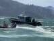 Photos posted by the Richmond Police Department showing rescue operations for a boat that capsized in rough waters.