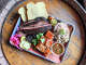 Barbecue tray including crispy pork bellyHoodoo Brown BBQ, Big Belly Tour, at Moo's Craft Barbecue, Los Angeles CA