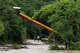 People walk along the swollen Frio River near Neal's Lodges in Concan on Wednesday.