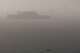 A San Francisco Police Department boat patrols the bay as authorities search for three missing passengers from the Volare, a 49-foot cabin cruiser carrying 20 passengers that capsized in rough seas Tuesday near Alcatraz Island in San Francisco.