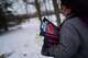 Jean Booth, who was targeted in a romance scam, carries copies of the book she wrote about her experience titled, "Hello Beautiful," which was how her scammer used to greet her, in Westlake, Ohio, Tuesday, Dec. 9, 2025.