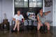 Bill Dozier, left, and Sharon Dozier sit on their flooded front porch along North Camp Street in Uvalde on Thursday, July 16, 2026, as they consider their next steps. They said water was ankle-deep inside their house Thursday morning.