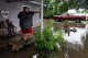 Skylor Dozier stands on the front porch of his grandparents’ house along North Camp Street in Uvalde on Thursday, July 16, 2026. He lives in a trailer behind Bill and Sharon Dozier’s flooded house.