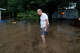 Bill Dozier walks through his flooded yard along North Camp Street in Uvalde on Thursday, July 16, 2026. He said water was up to his ankles inside his home.