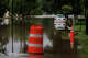 A car is surrounded by floodwater on East Mesquite Street near the intersection of North Camp Street in Uvalde, Thursday, July 16, 2026.