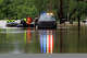 First responders with the Texas Game Wardens rescue a man from his home on East Mesquite Street in Uvalde on Thursday, July 16, 2026, after the Leona River flooded the roadway.