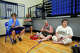 From right, Jodye Koopland, her sister Tamra Ward, husband Max Koopland and son Grady Koopland sit on the gymnasium floor in a makeshift evacuation center at Comfort High School after heavy rain caused flooding in Comfort, Texas on Thursday, July 16, 2026. The Koopland family is from the Dallas area, but has been traveling in an RV and has been living in Comfort for about one month.