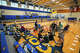 The Harrison family sits in circles on the floor and in camping chairs in a makeshift evacuation center at Comfort High School after heavy rain caused flooding in Comfort, Texas on Thursday, July 16, 2026. The family was staying at The Meyer Hotel for a family reunion when they evacuated in the morning as the level of Cypress Creek rose.