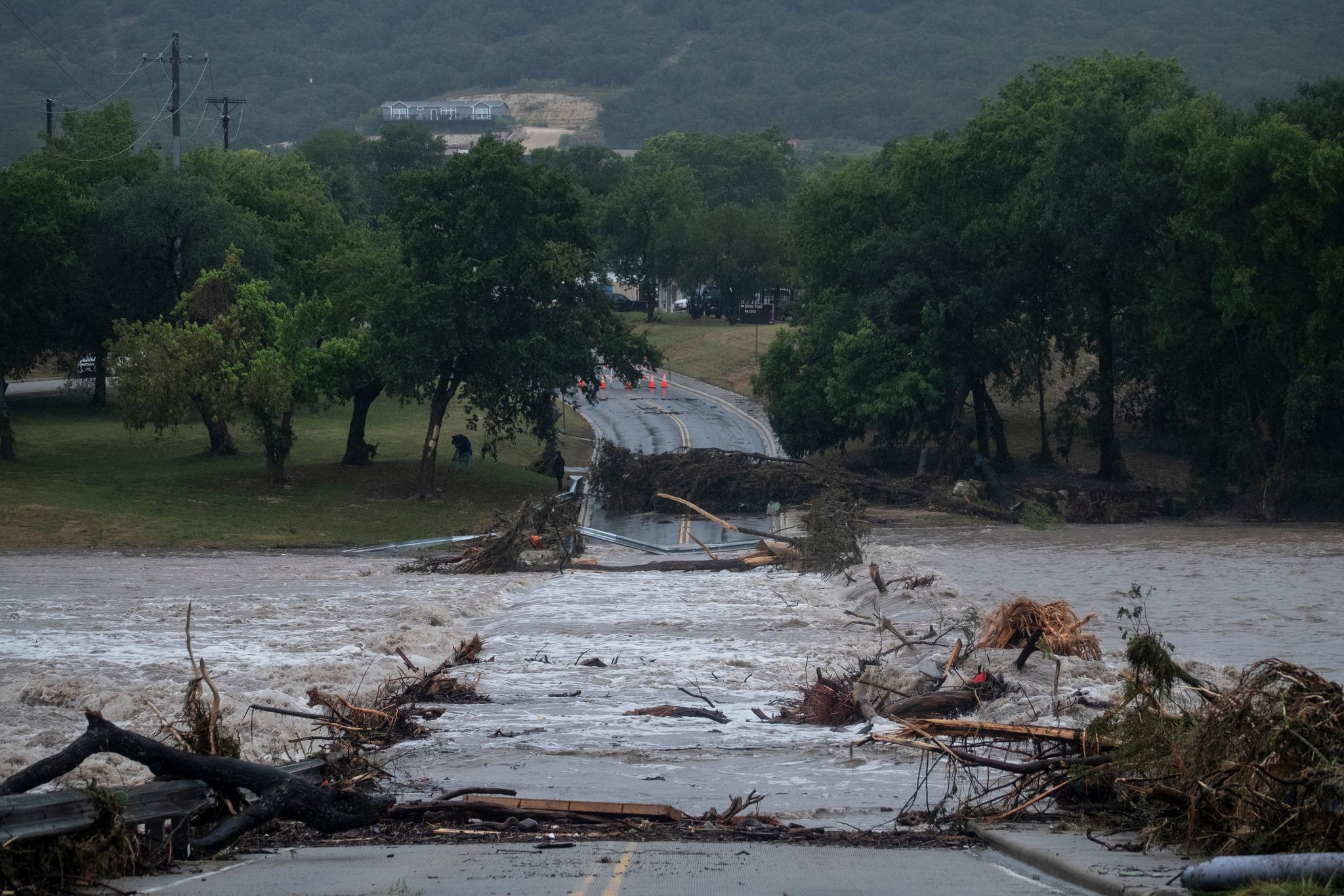 Texas flooding surges from storms as rescuers pull people from water