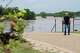 Mark Isbell, owner of Arrowhead Creek Vineyards, watches as the Perdenales River floods his property in Stonewall, Thursday, July 16, 2026. Isbell, his wife Kim and their dog were able to evacuate the RV they reside in on the property before the flood swelled and overtook their home.