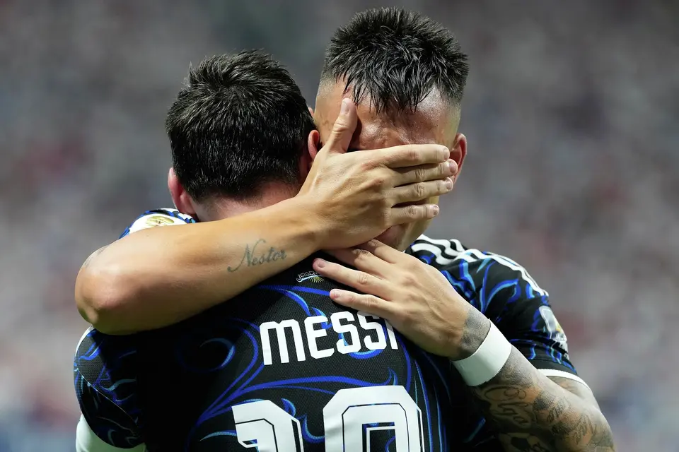 Argentina's Lautaro Martinez hugs teammate Lionel Messi celebrating after scoring their side's second goal during the World Cup semifinal soccer match between England and Argentina in Atlanta, Wednesday, July 15, 2026. (AP Photo/Rebecca Blackwell)