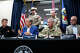 Texas Governor Greg Abbott, center left, with Chief of the Texas Division of Emergency Management Nim Kidd, left, Major General Thomas M. Suelzer, center right, and TxDOT Executive Director Marc Williams, right, hold a press conference to share the latest information from flooding around Texas before providing an update to the press at the State Operations Center in Austin, Thursday evening, July 16, 2026.
