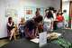 Guests sign up during Coffee and Conversations event by Paper for Water, a nonprofit bringing clean water to thirsty communities around the world, on Thursday, July 16, 2026 at their office in Dallas.